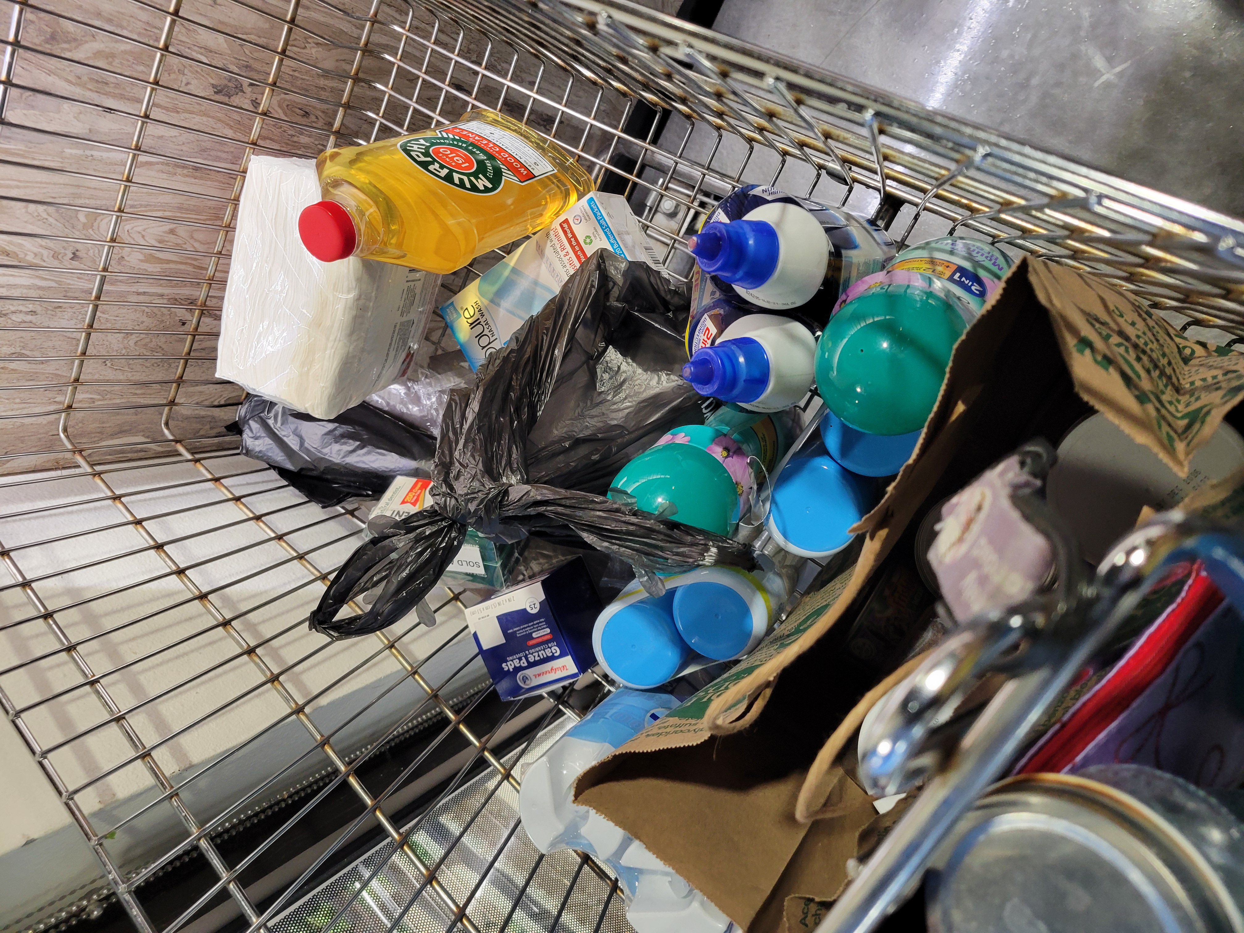 Household supplies in a shopping cart